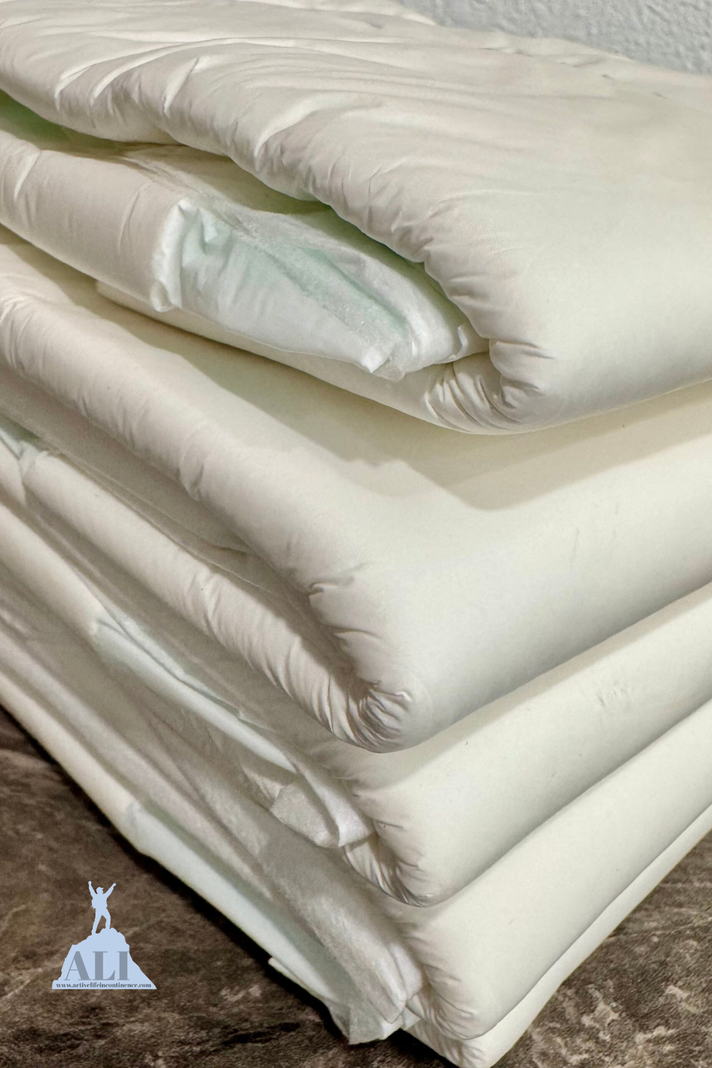 Stack of Depends Plastic Backed Adult Diapers